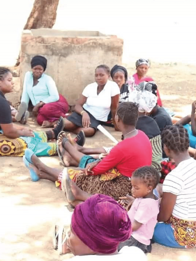 green girls platform tree planting exercise with students
