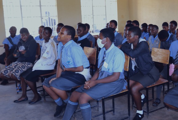 green girls platform tree planting exercise with students